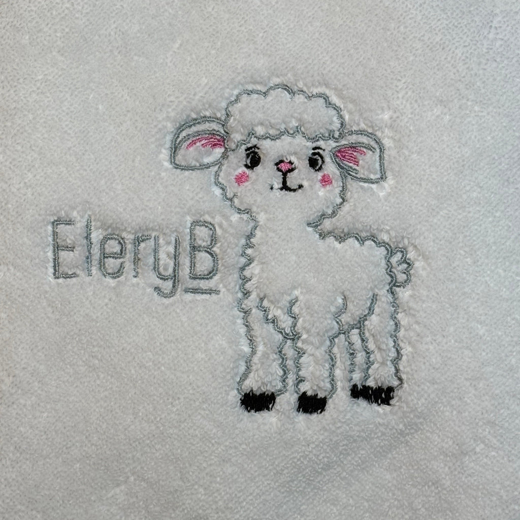 EleryB logo and signature embroidered lamb on soft white fabric
