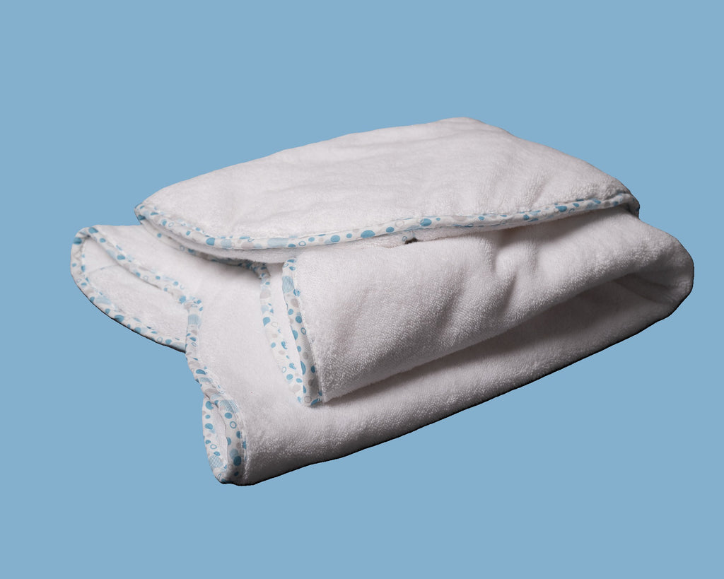 Folded EleryB hooded towel with blue geometric trim and double-thick softness
