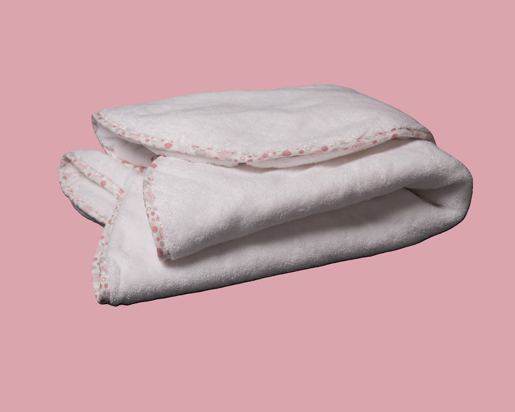 Folded EleryB hooded towel with pink geometric trim and double-thick softness
