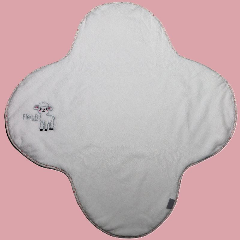 White EleryB towel with pink geometric trim and embroidered lamb logo, full view
