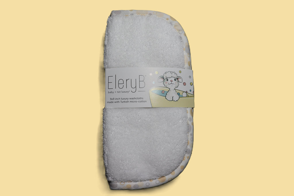 Three EleryB hypoallergenic washcloths with yellow trim bundled in logo bellyband
